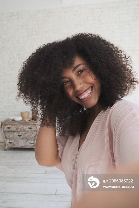 Vertical video pov. Trendy happy mixed woman vlogger dances and recording videostream video for soci