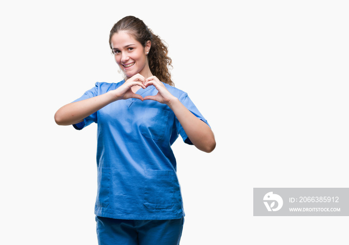 Young brunette doctor girl wearing nurse or surgeon uniform over isolated background smiling in love