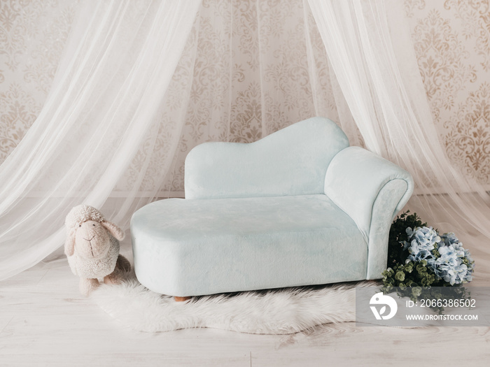 Couch for a baby photo session in a photo studio