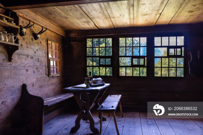 Living room, eating area and furniture in a traditional Swiss wooden farmhouse, near Bern, Switzerla