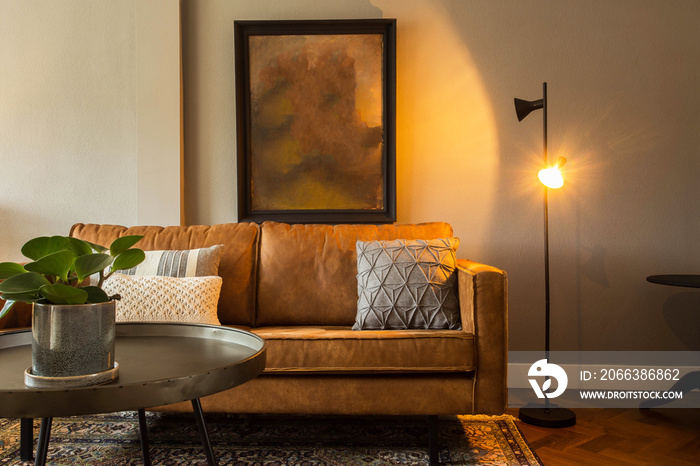 interior of a modern living room with brown sofa and blank painting, elegant retro design with brown