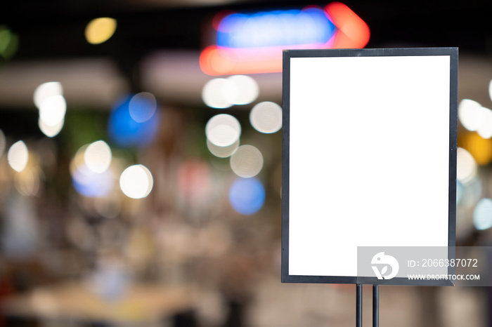 mockup white poster with black frame stand in front of blur restaurant cafe background for show