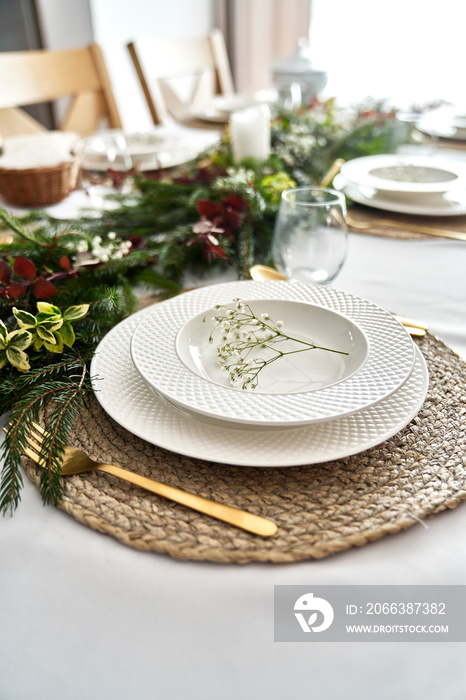 Close up of empty plate on table with Christmas decorations