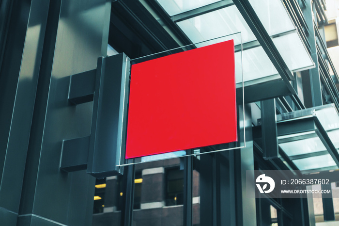 Red square signboard on the wall of a modern shopping mall, mock up