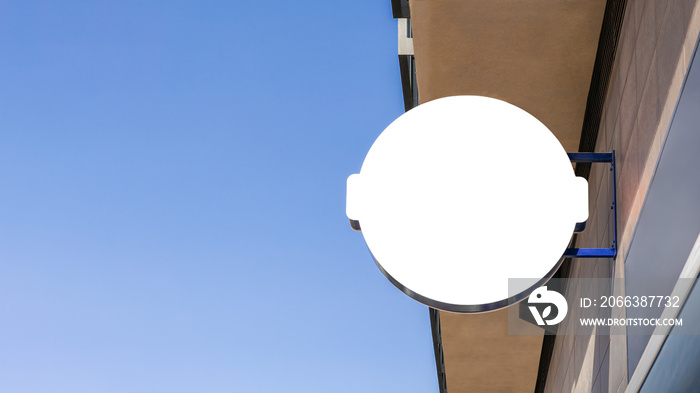 Blank circle sign mockup in the urban environment, on the facade empty space