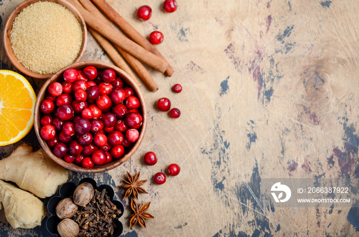 Cranberry sauce ingredients on a wooden background. Top view, flat lay, copy space.