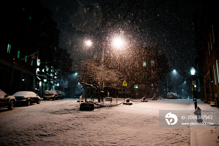 Boston, Massachusett - January 16, 2012: Night of snowfall in the city, streets covered with snow an