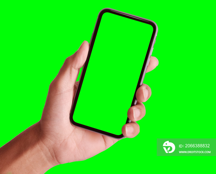Studio shot of hand shows mobile smartphone with green screen in vertical position isolated on backg