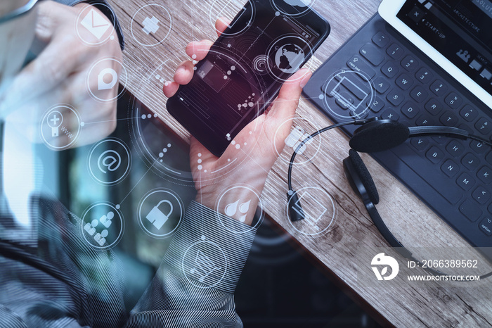 top view of man hand using VOIP headset with digital tablet comp