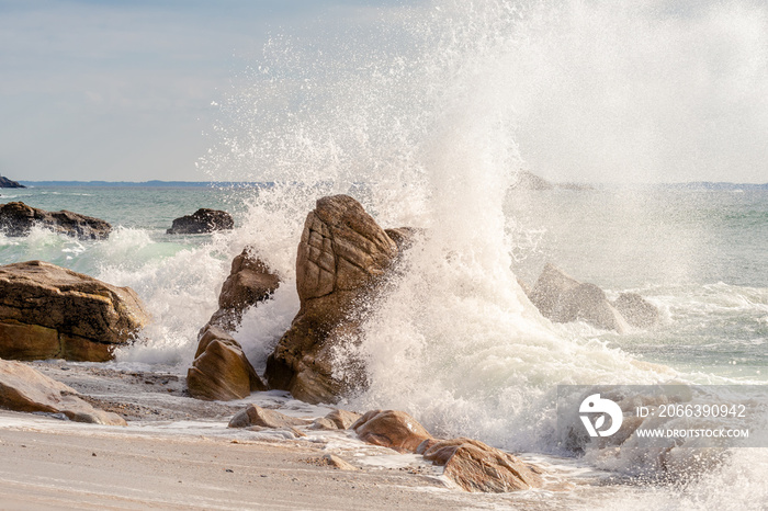 French landscape - Bretagne. A beautiful beach with wild cliffs in the background at sunset.