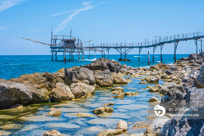 The beautiful beach of Calata Turchina with crystal clear and blue sea and the Trabocco in background