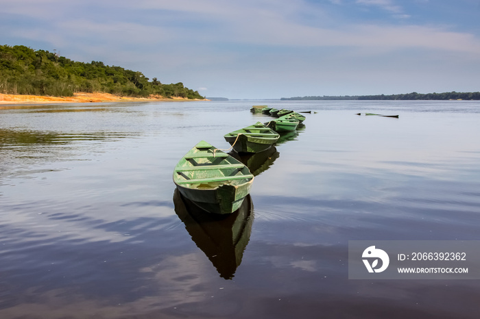 Boats on the glassy Rio Negro, Anavilhanas Archipelago, Brazil