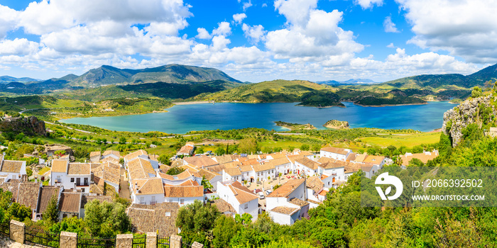 Panorama of Zahara de la Sierra village with lake and mountains in background, Grazalema National Park, Spain