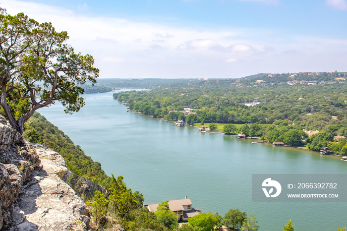 View of the Colorado River and Hill Country village from top of Mount Bonnell In Austin Texas