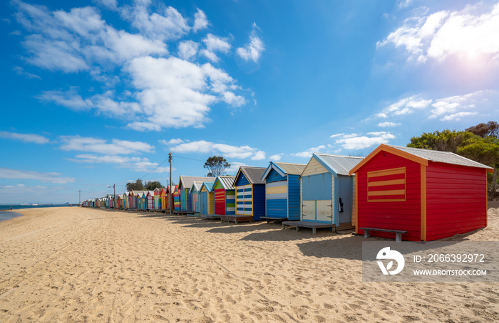 Beautiful Bathing houses on white sandy beach at Brighton beach in Melbourne, Australia.