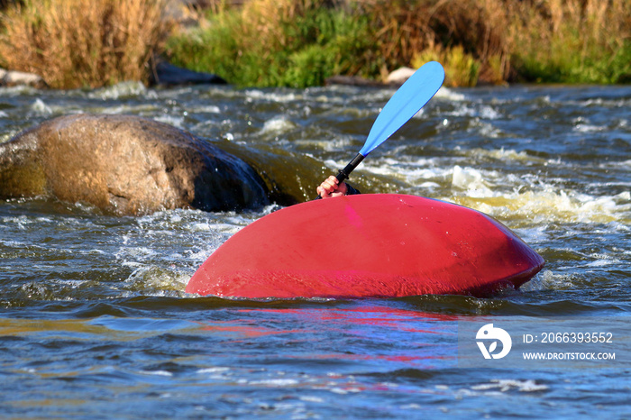 Overturn (capsize) man in kayak in whitewater river