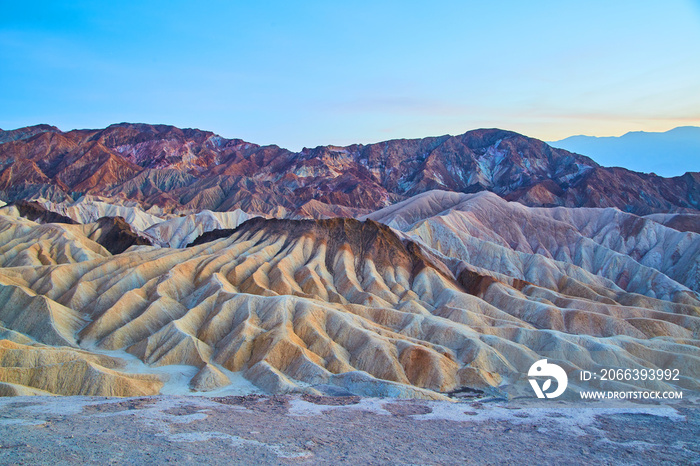 Soft dusk light at Zabriskie Point with colorful waves of sediment