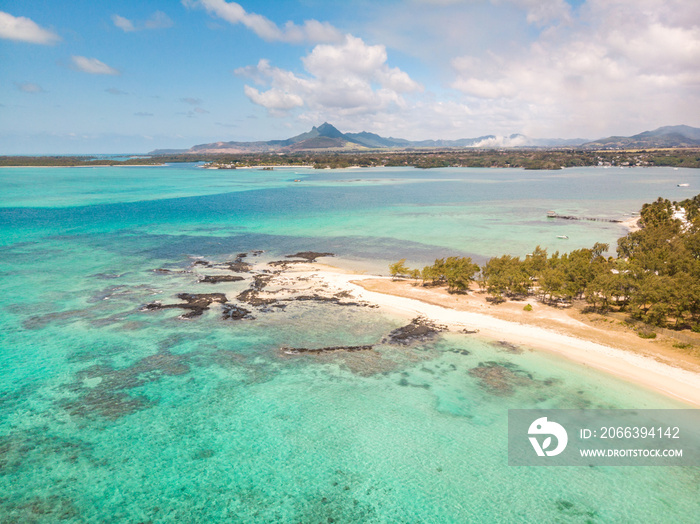 Aerial view of beautiful tropical beach with turquoise sea. Tropical vacation paradise destination of D’eau Douce and Ile aux Cerfs Mauritius