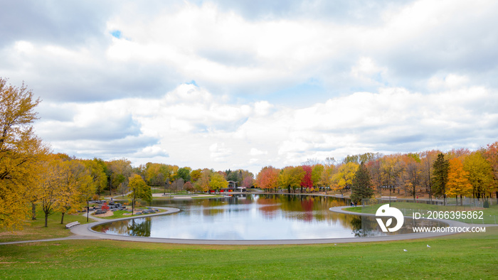 Beaver lake at the top of Mont-Royal, as foliage bursts with autumn colors. Montreal, Canada