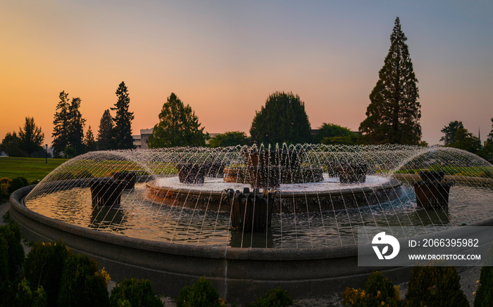 The water fountain and garden of the Washington State Capitol in Olympia at sunset