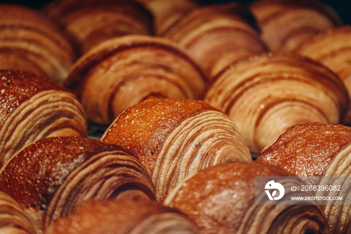 Close-up of fresh and beautiful pain au chocolats in a bakery showcase.