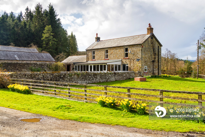 Idyllic view on a beautiful and peaceful rural house on and English countryside. United Kingdom