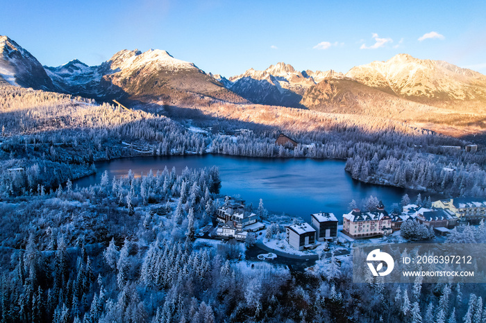 Winter frozen view on Lake Strbske pleso. Strbske lake in High Tatras National Park, Slovakia landscape, Europe.