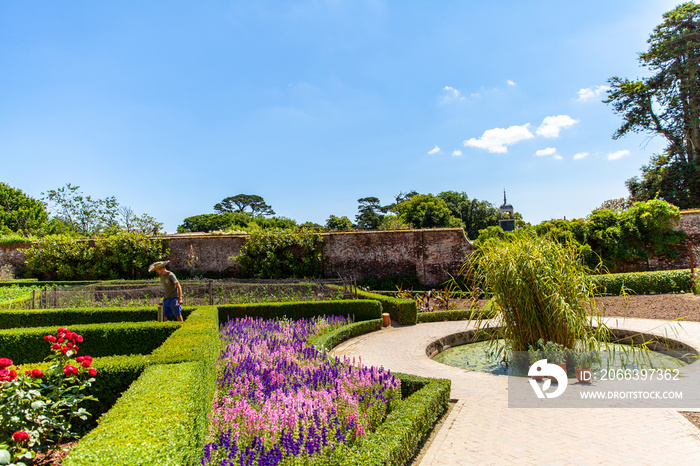 gardener in the landscaping at the Lost Gardens of Heligan attractions Cornwall UK