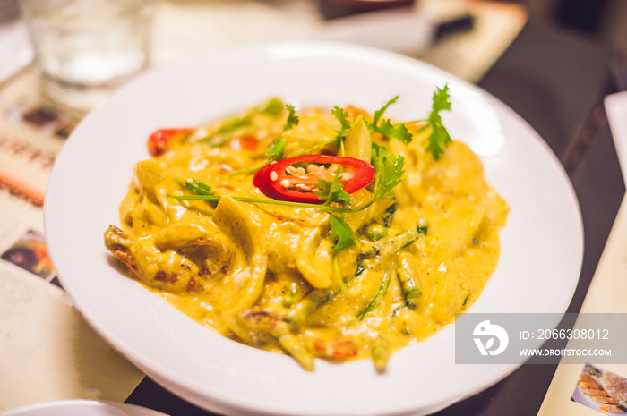 Thai yellow curry with shrimps. Thai food concept