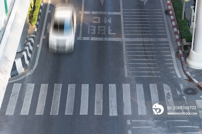 Crosswalk and car, Busy city street and car in motion blur on crosswalk