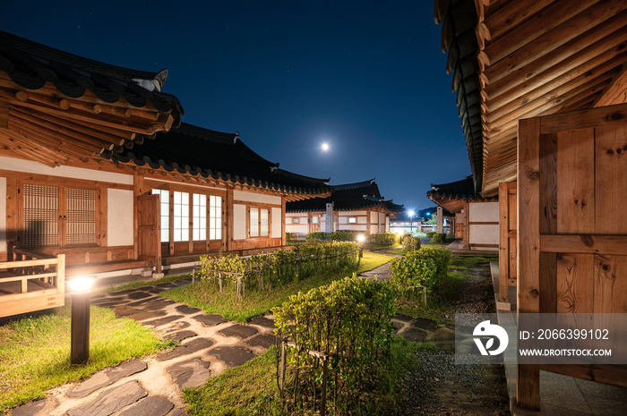 Architecture traditional wooden house illumination with the moon in blue sky at Ojuk Hanok Village