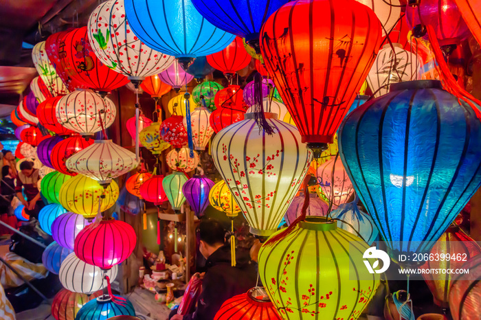 Colourful cloth lanterns lamp light shades hanging outside in Hoi An, Vietnam