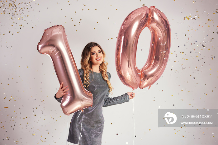 Portrait of woman with balloons building the figure  10