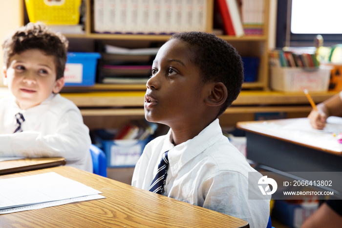 Students sitting at desk in classroom