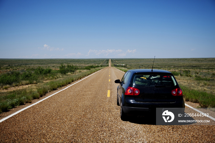 Car on road against blue sky