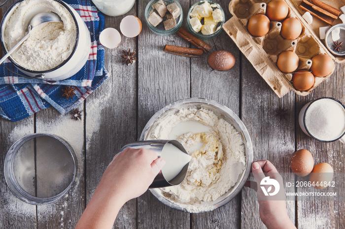 Making dough top view on rustic wood background