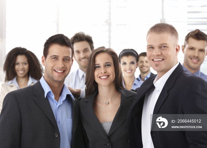 Group of happy successful business people smiling