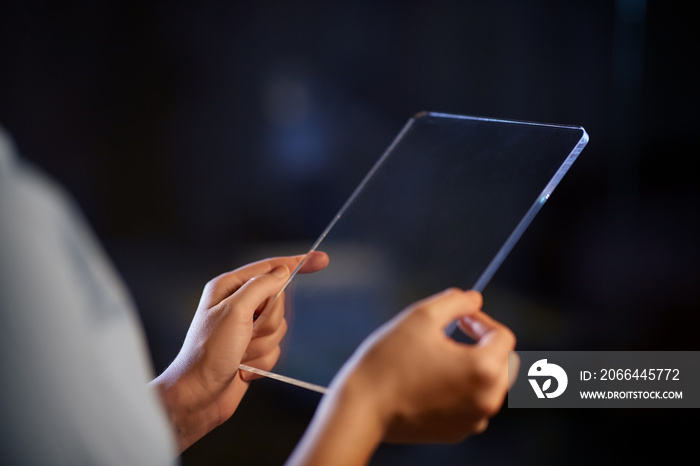 business, people and technology concept - close up of hands with transparent tablet pc computer