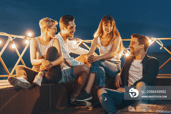 Group of friends enjoying outdoors at roof