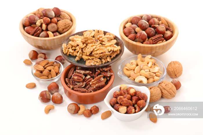 assorted of nuts in bowl isolated on white background