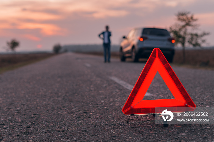 Warning triangle sign on the road