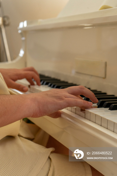 UK, London, Close-up of man playing piano