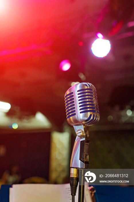 illuminated microphone on the stage and auditorium