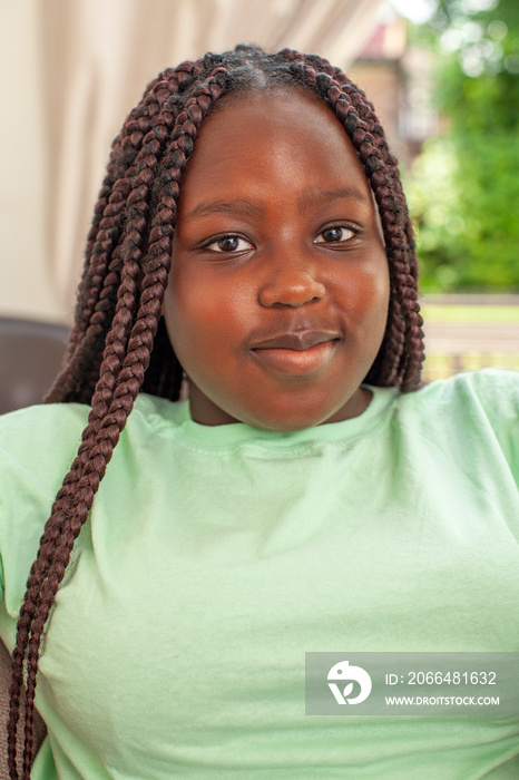 Portrait of smiling girl with braided hair