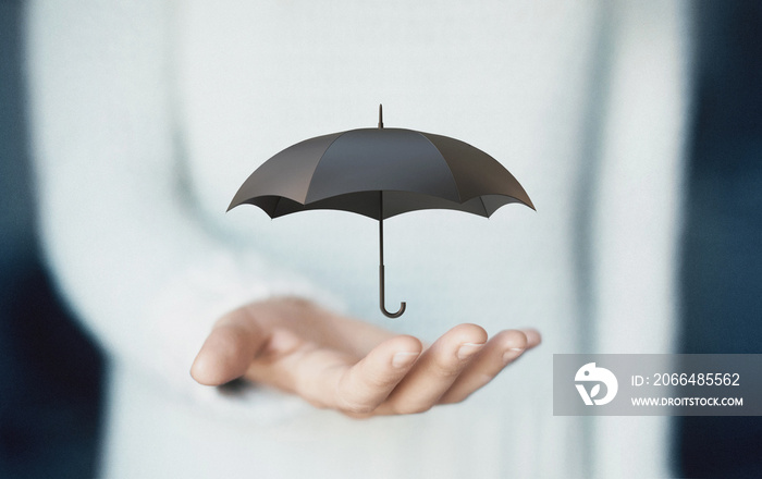 Woman hand with a black umbrella