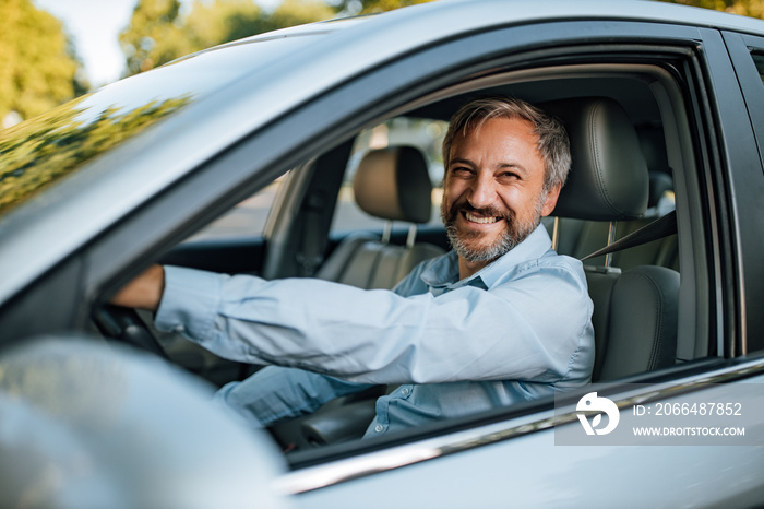 Man prepares to drive a car.