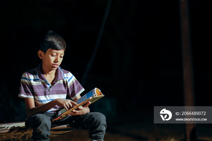 Poor child doing his homework at home