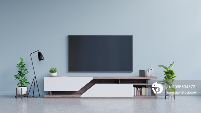 蓝色背景的现代客厅橱柜上的电视。
