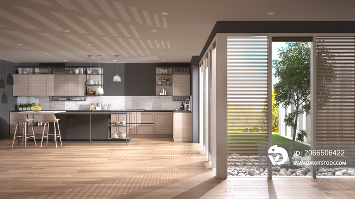 庭院住宅中的现代极简主义开放空间，带岛和凳子的灰色和木制厨房，阳台