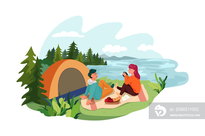 A man and woman setting a tent by lake